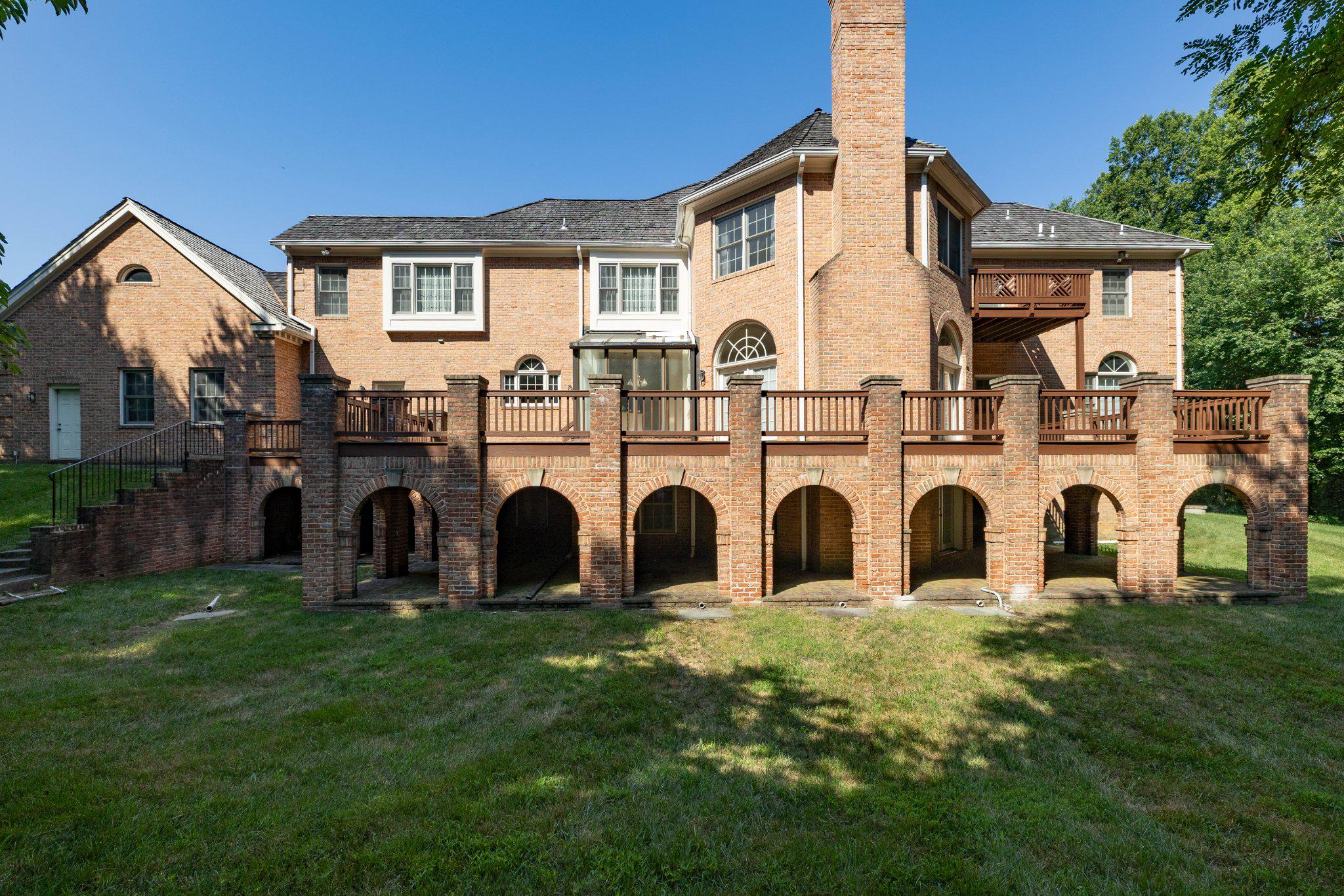 731 Utterback Store Road Great Falls, VA 22066 - Photo 14 of 19 Brick home with spacious deck and patio.