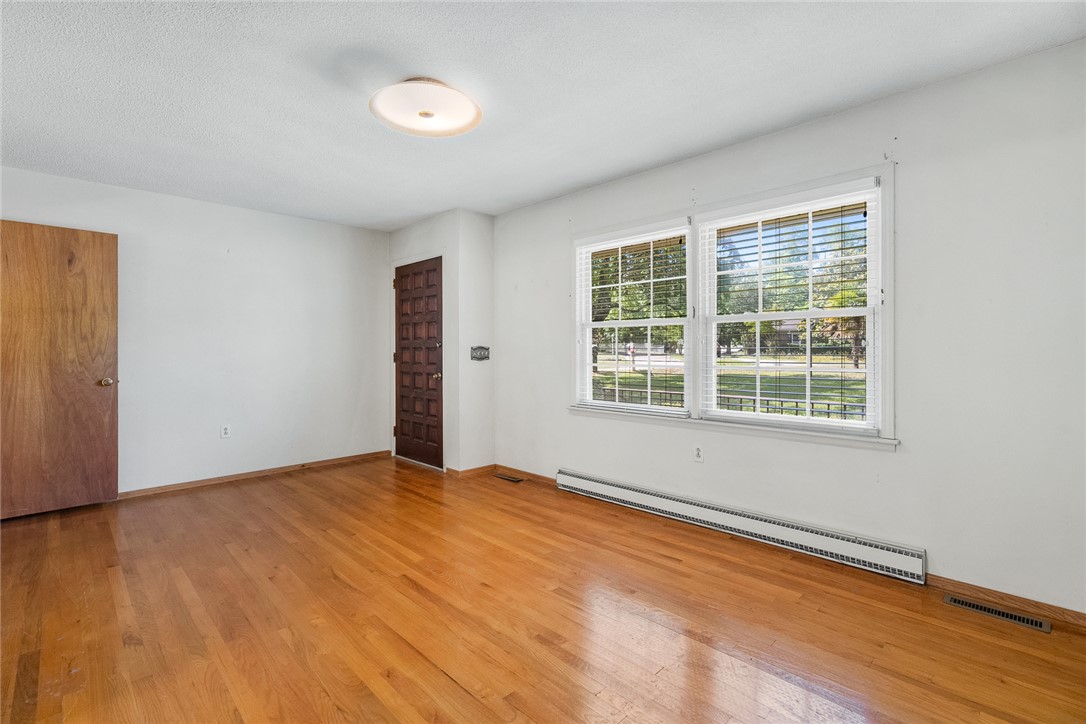 2101 Old Spring Drive Anderson, SC 29625 - Photo 4 of 36 Hardwood floors and a sun-drenched window create an inviting living space.