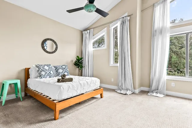 a bedroom with a bed and window