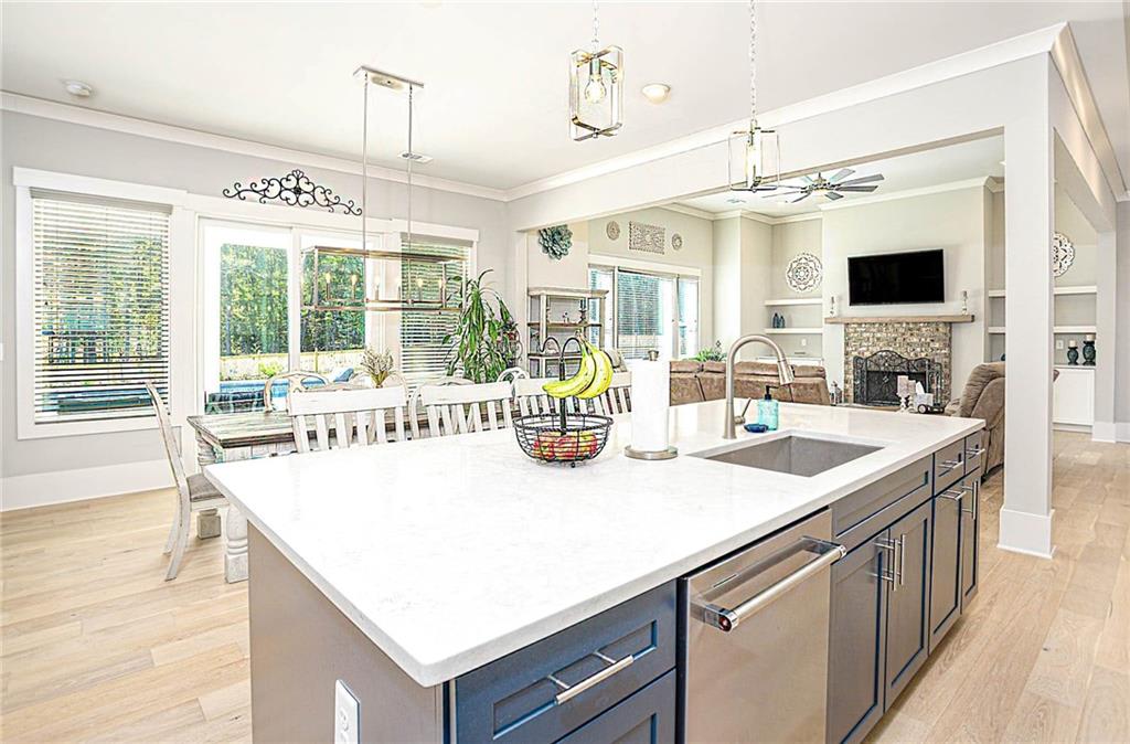 255 Old Town Road Dacula, GA 30019 - Photo 16 of 35 a kitchen with a sink a counter top space and living room view