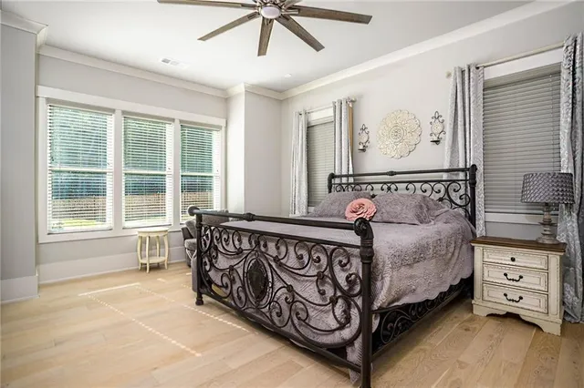 a bedroom with a bed and window