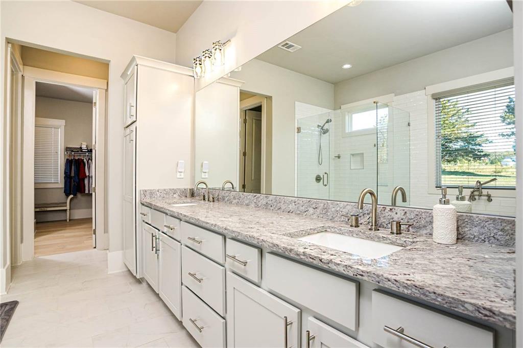 255 Old Town Road Dacula, GA 30019 - Photo 20 of 35 a bathroom with double sink and a mirror