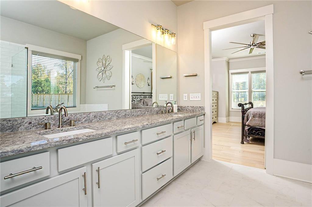 255 Old Town Road Dacula, GA 30019 - Photo 23 of 35 a bathroom with double vanity and a mirror