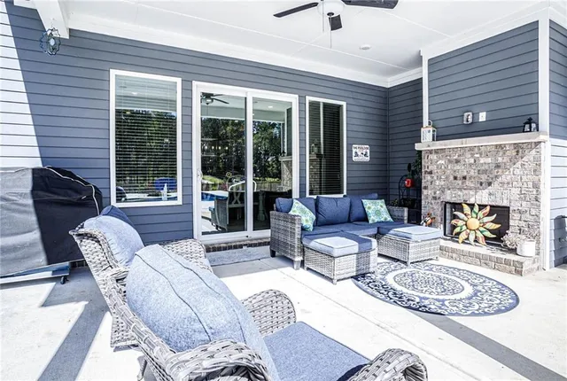 a living room with furniture and a fireplace