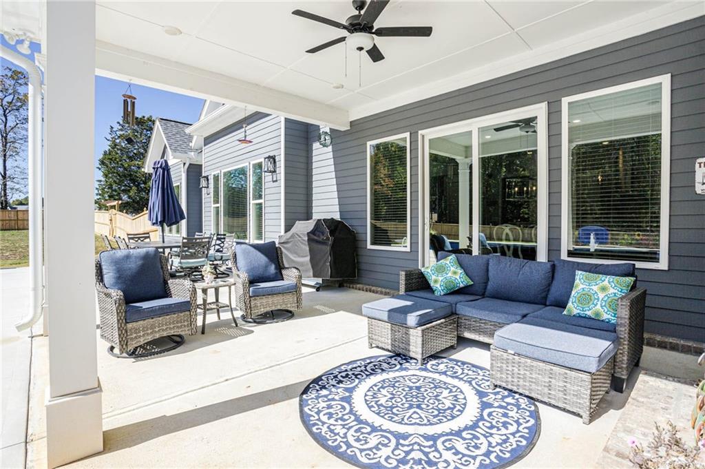 255 Old Town Road Dacula, GA 30019 - Photo 32 of 35 a living room with furniture and a large window