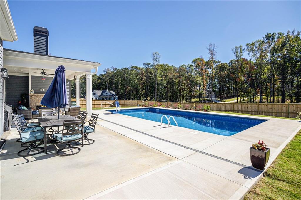 255 Old Town Road Dacula, GA 30019 - Photo 33 of 35 a view of a swimming pool with chairs