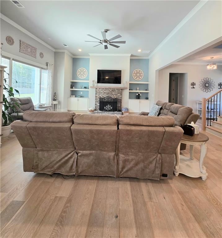 255 Old Town Road Dacula, GA 30019 - Photo 6 of 35 a living room with furniture a fireplace and a flat screen tv