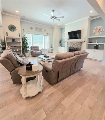 a living room with furniture and a fireplace