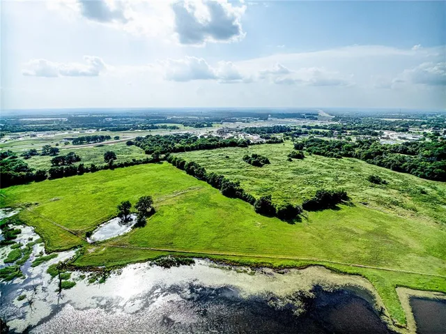 a view of a garden with a building