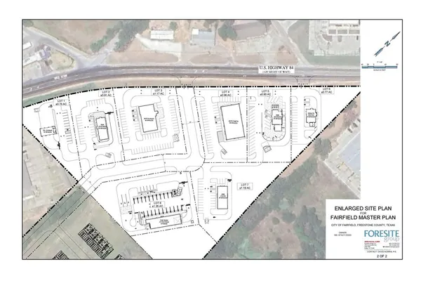 a view of a small yard with potted plants