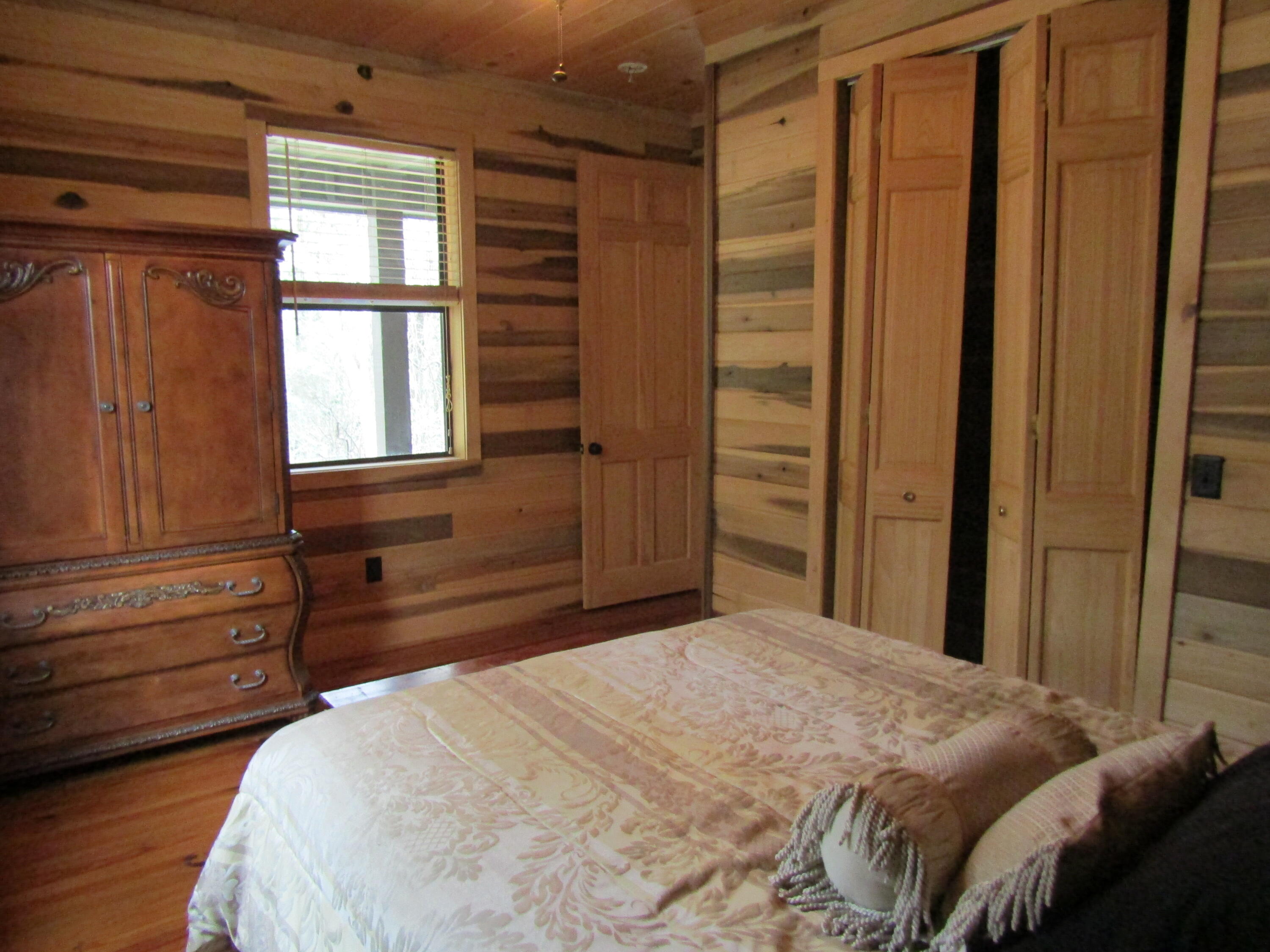 2948 Alford Road Samson, AL 36477 - Photo 17 of 121 a bedroom with a bed and a window