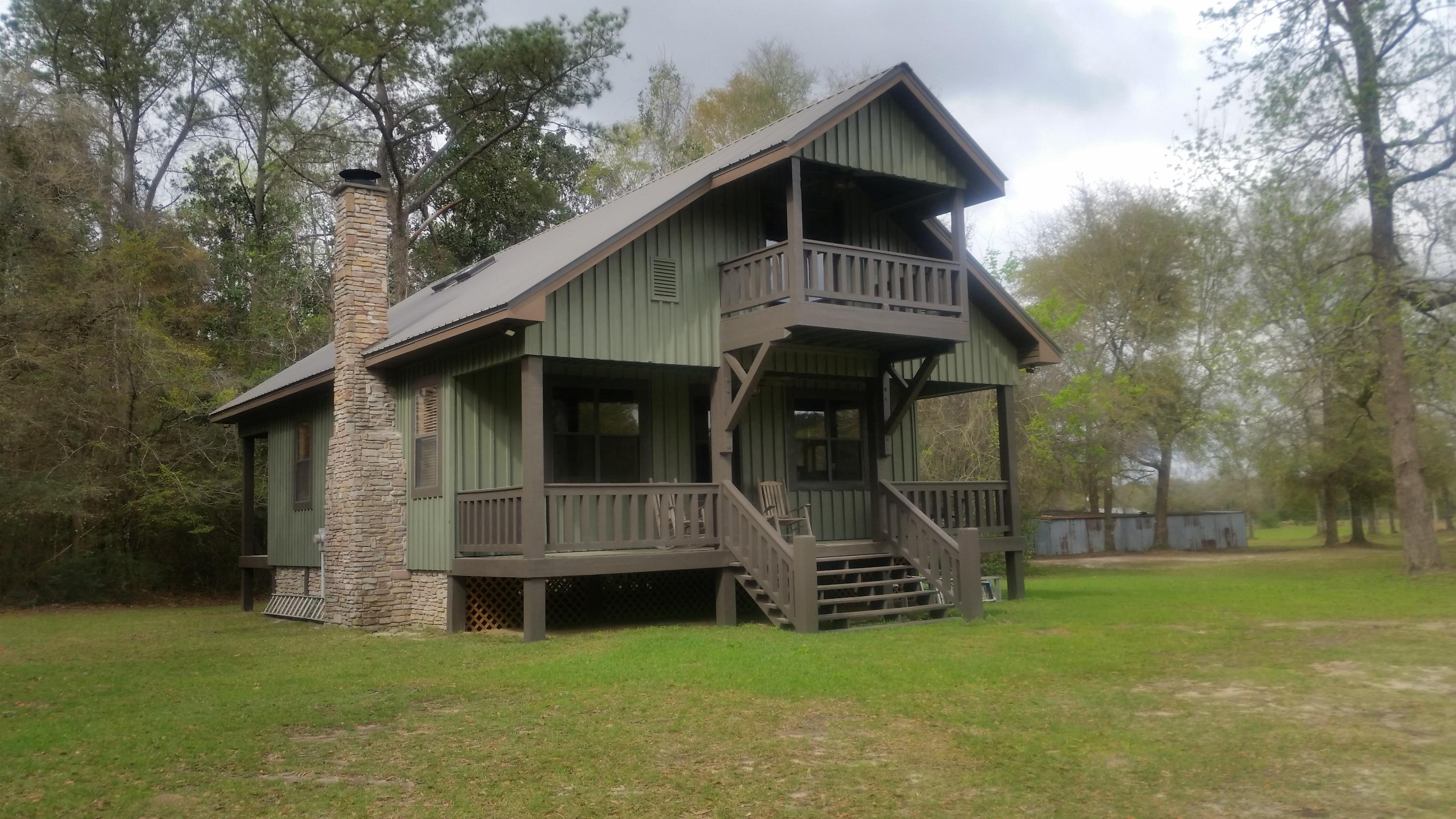 2948 Alford Road Samson, AL 36477 - Photo 2 of 121 a front view of a house with garden