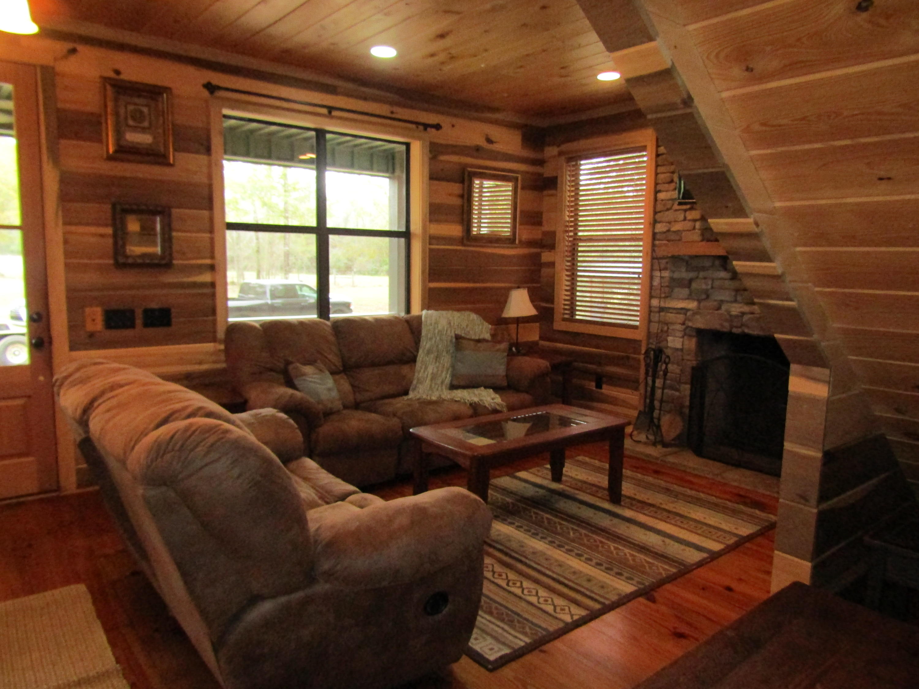 2948 Alford Road Samson, AL 36477 - Photo 9 of 121 a living room with furniture a fireplace and a large window
