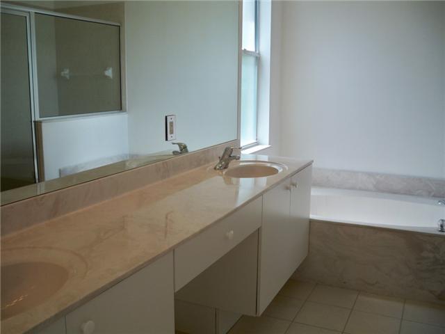 5565 Spanish River Road Fort Pierce, FL 34951 - Photo 8 of 12 a bathroom with a sink and a mirror