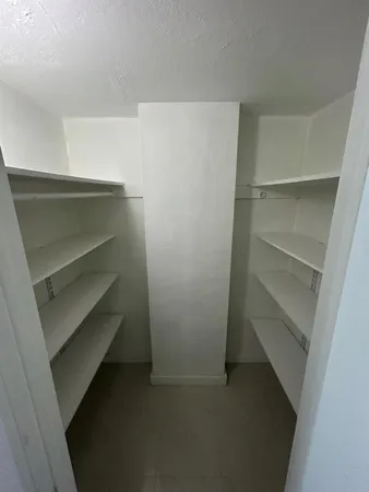 a view of an empty walk in closet