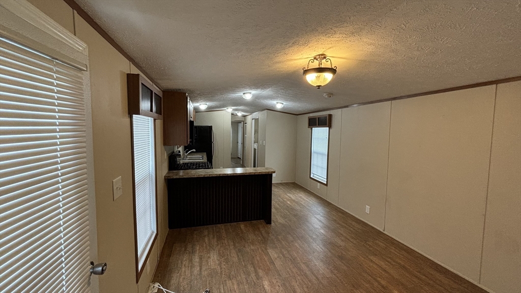 557 Southwest Cutoff, Unit 47 Worcester, MA 01607 - Photo 2 of 10 a view of gallery with wooden floor