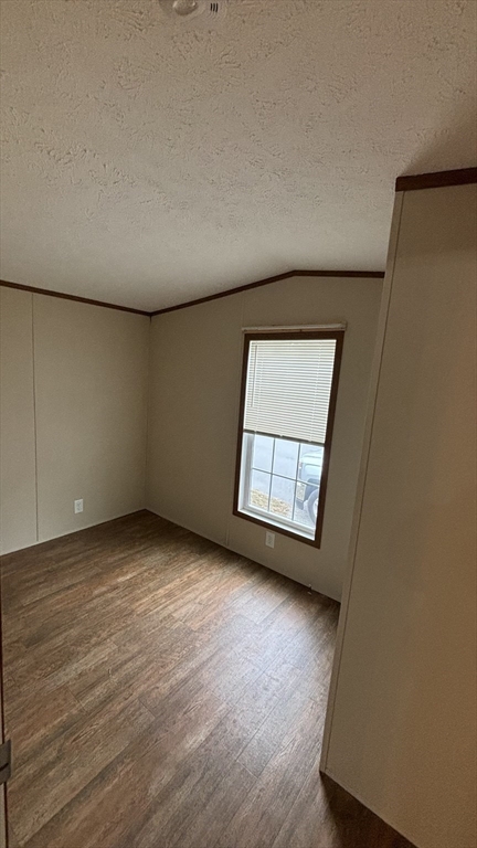 557 Southwest Cutoff, Unit 47 Worcester, MA 01607 - Photo 4 of 10 an empty room with wooden floor and windows