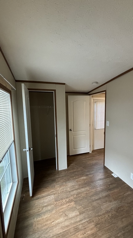 557 Southwest Cutoff, Unit 47 Worcester, MA 01607 - Photo 5 of 10 an empty room with windows