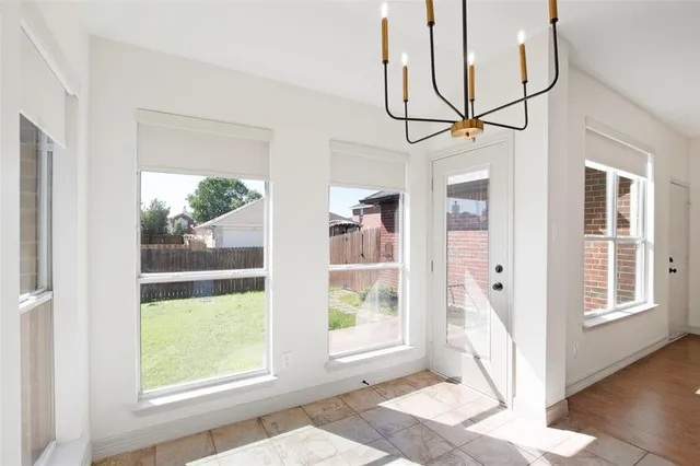 a view of entryway with wooden floor and door