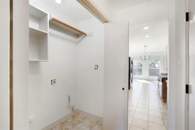 a view of a hallway with wooden shelves