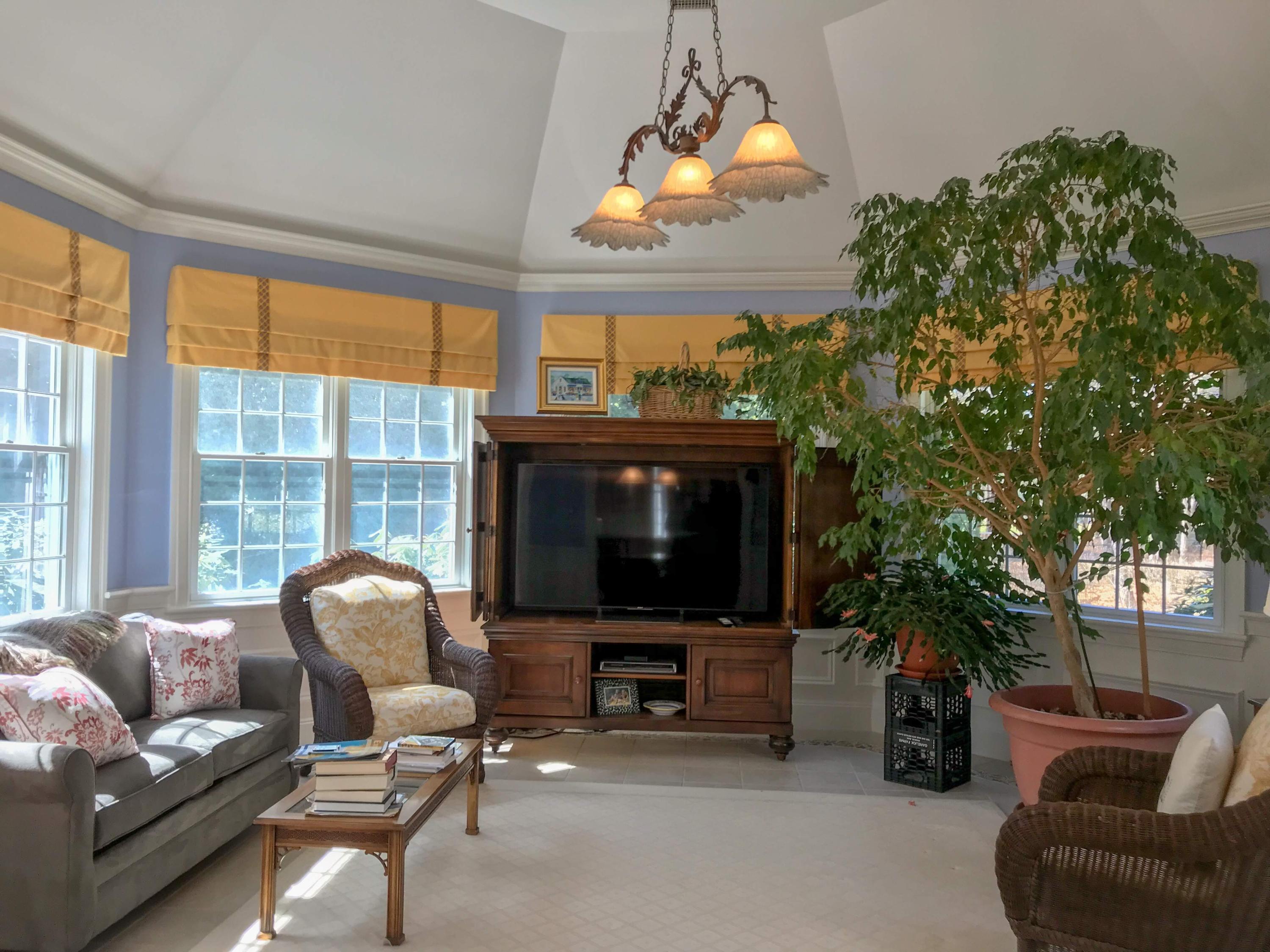 163 Pineleigh Path Osterville, MA 02655 - Photo 11 of 23 a living room with furniture a fireplace and a flat screen tv