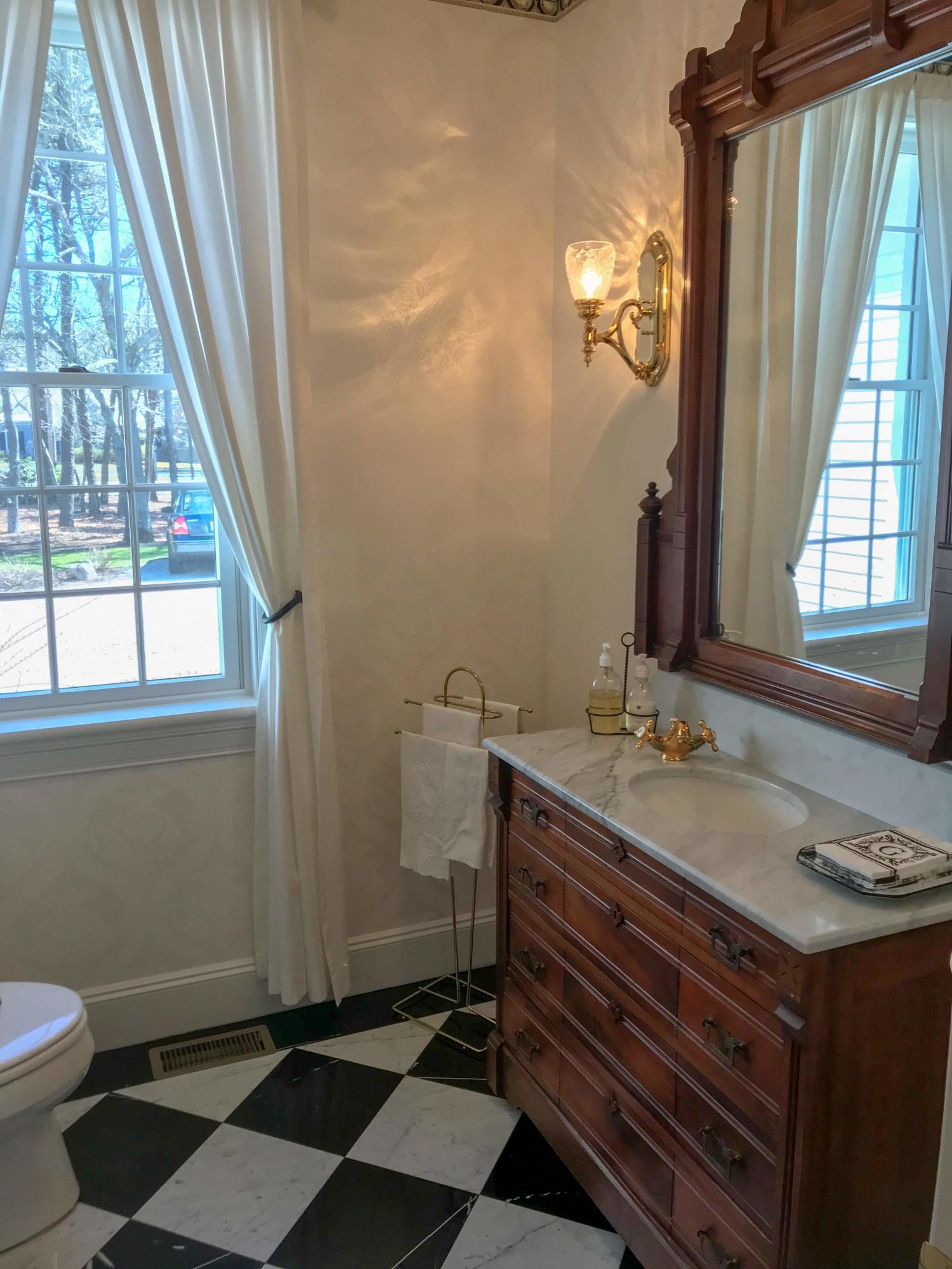 163 Pineleigh Path Osterville, MA 02655 - Photo 15 of 23 a bathroom with a granite countertop sink and a mirror