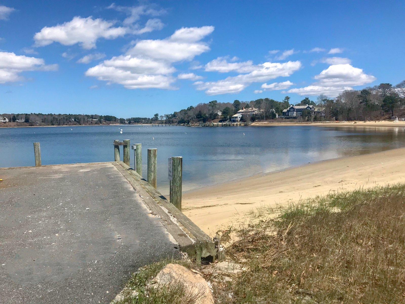 163 Pineleigh Path Osterville, MA 02655 - Photo 2 of 23 a view of a lake with a mountain in the background