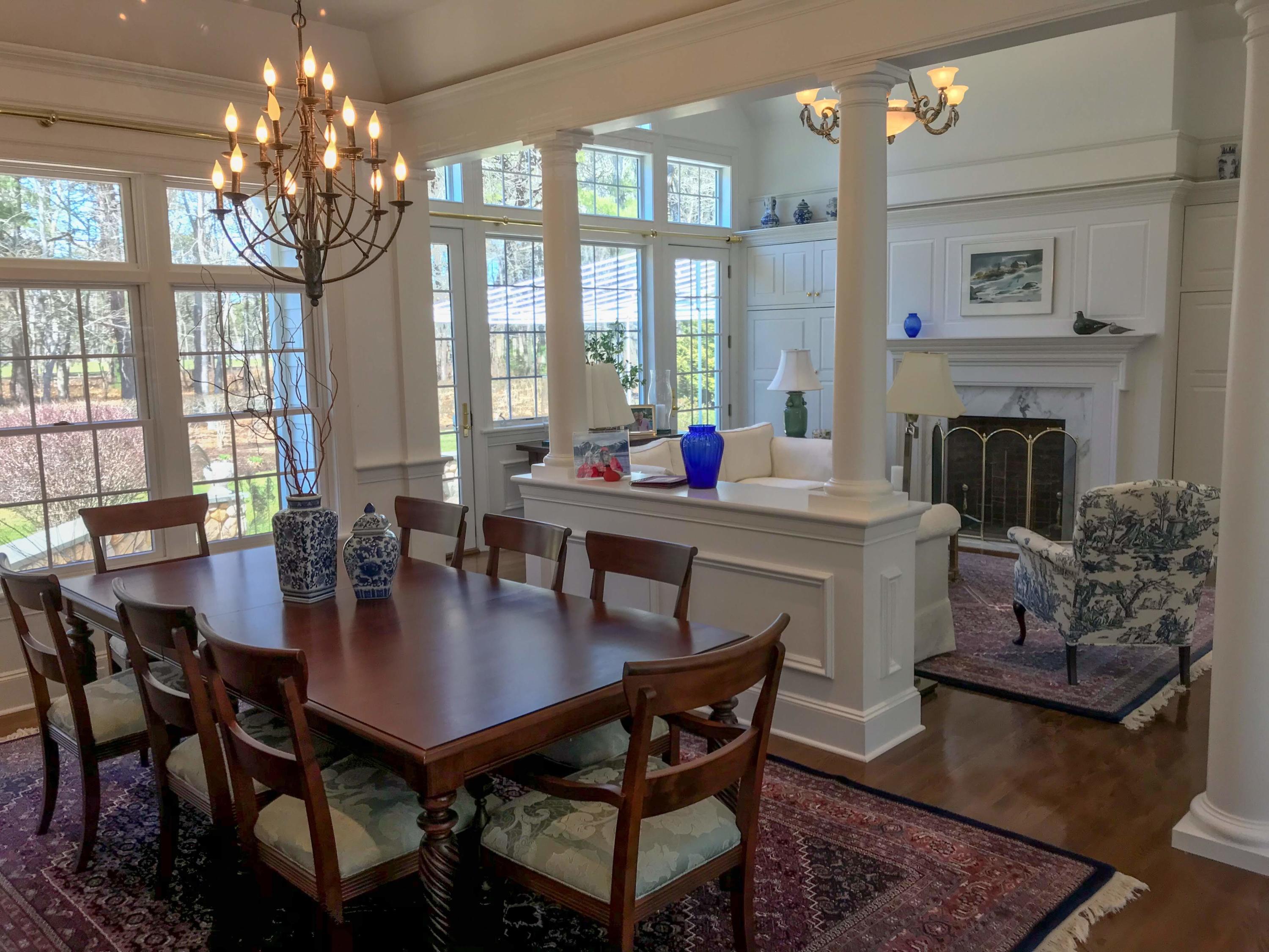 163 Pineleigh Path Osterville, MA 02655 - Photo 5 of 23 a view of a dining room with furniture a chandelier and wooden floor
