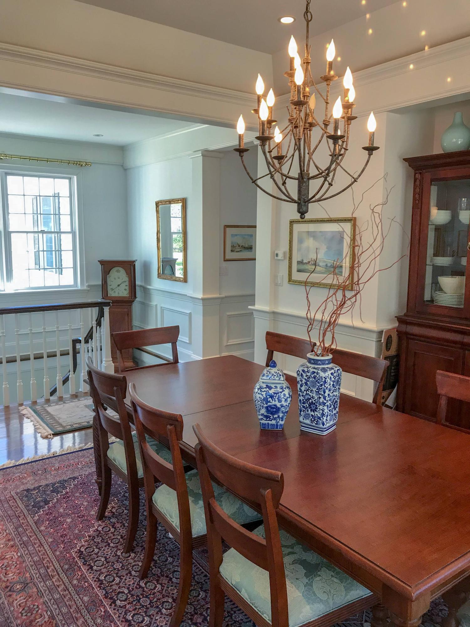 163 Pineleigh Path Osterville, MA 02655 - Photo 6 of 23 a view of a dining room with furniture a chandelier and wooden floor