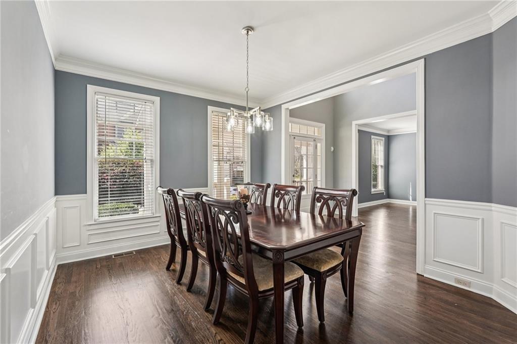 4708 Arbor Crest Place Suwanee, GA 30024 - Photo 11 of 102 a view of a dining room with furniture window and wooden floor