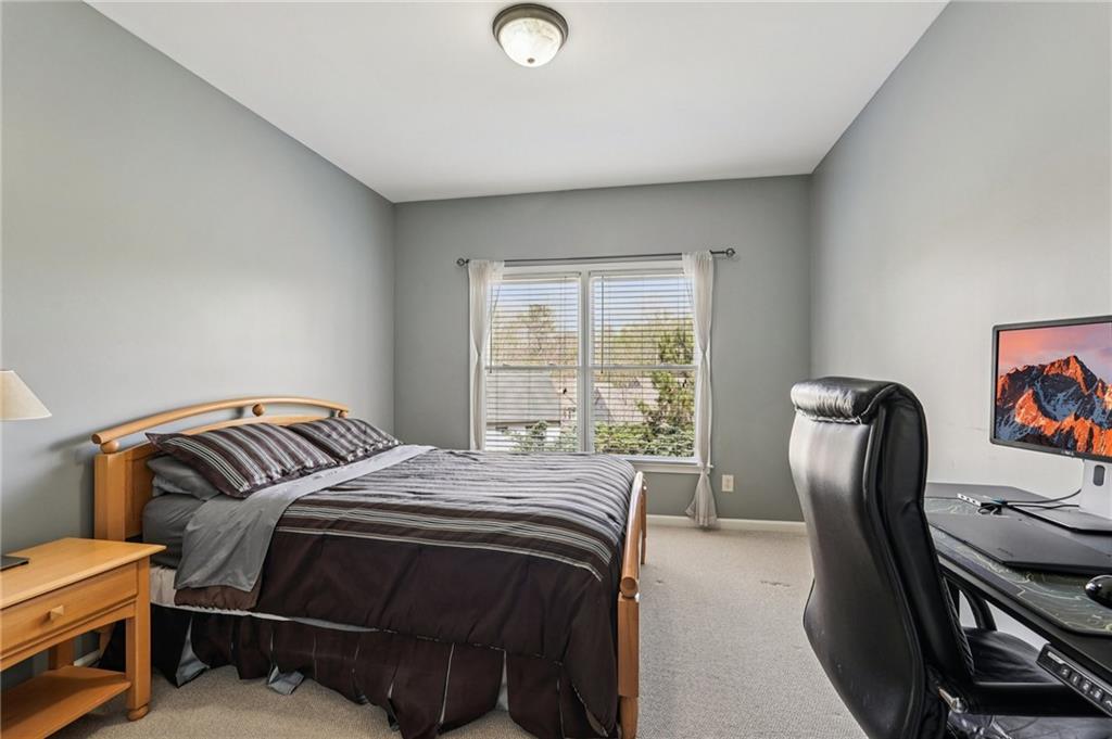 4708 Arbor Crest Place Suwanee, GA 30024 - Photo 14 of 102 a bedroom with a bed and a window