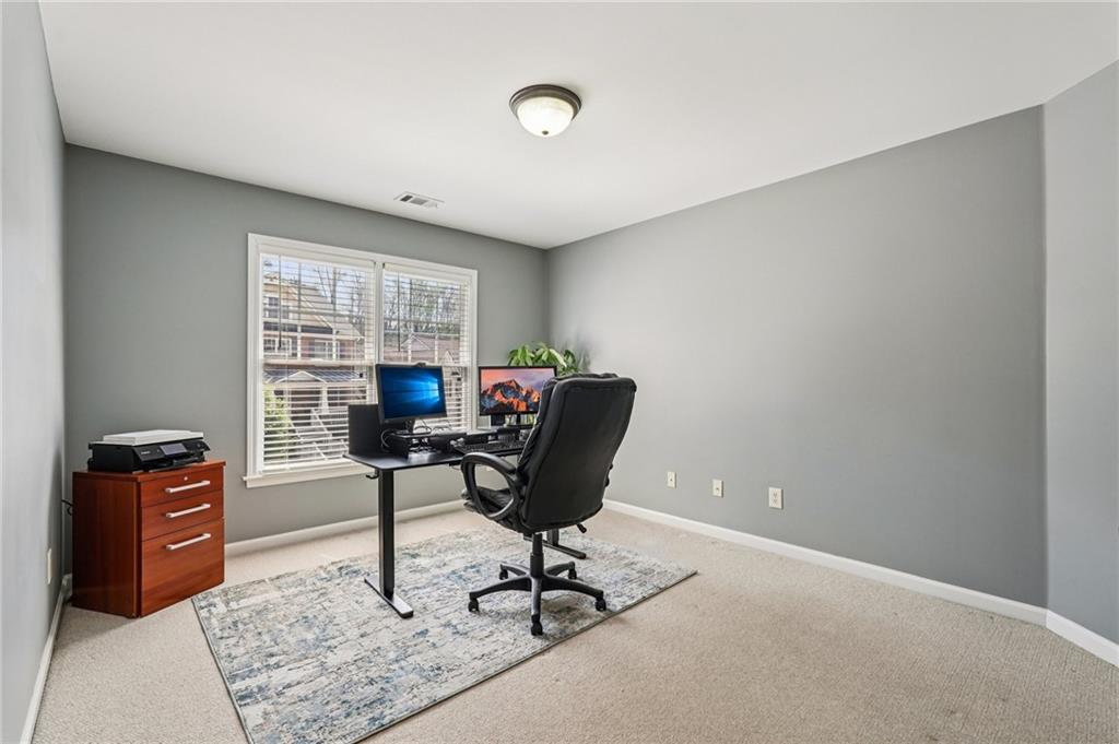 4708 Arbor Crest Place Suwanee, GA 30024 - Photo 33 of 102 a view of a workspace with furniture and a window
