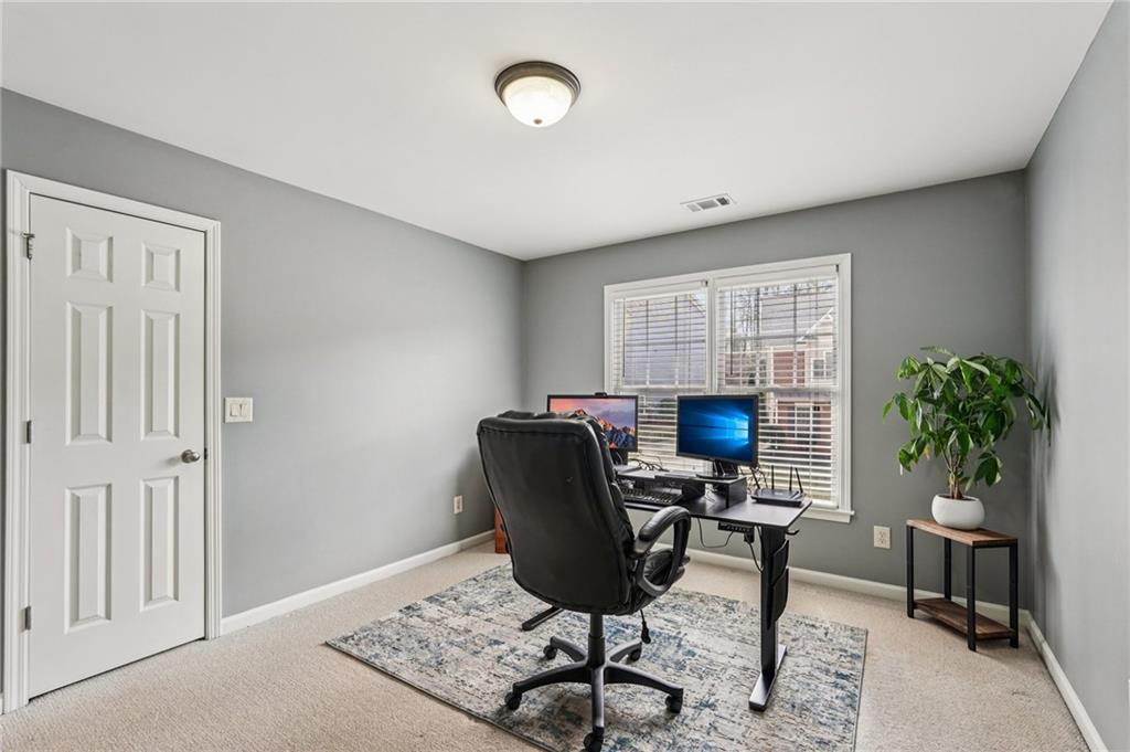 4708 Arbor Crest Place Suwanee, GA 30024 - Photo 34 of 102 a view of a workspace with furniture and a window