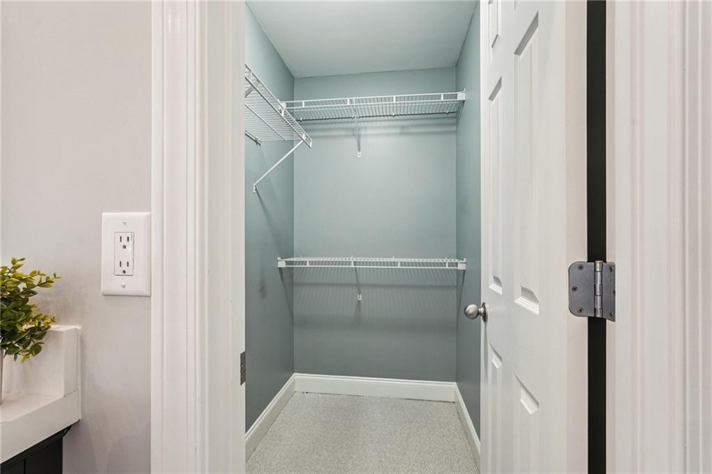 4708 Arbor Crest Place Suwanee, GA 30024 - Photo 47 of 102 a bathroom with a glass shower door