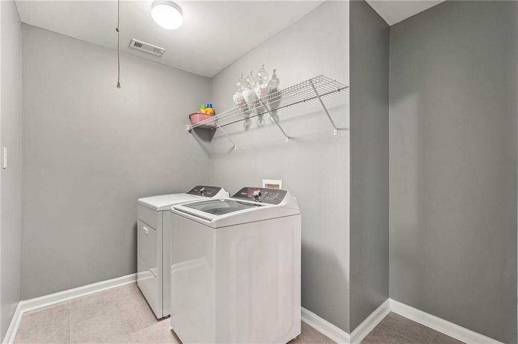 4708 Arbor Crest Place Suwanee, GA 30024 - Photo 48 of 102 a utility room with dryer and washer