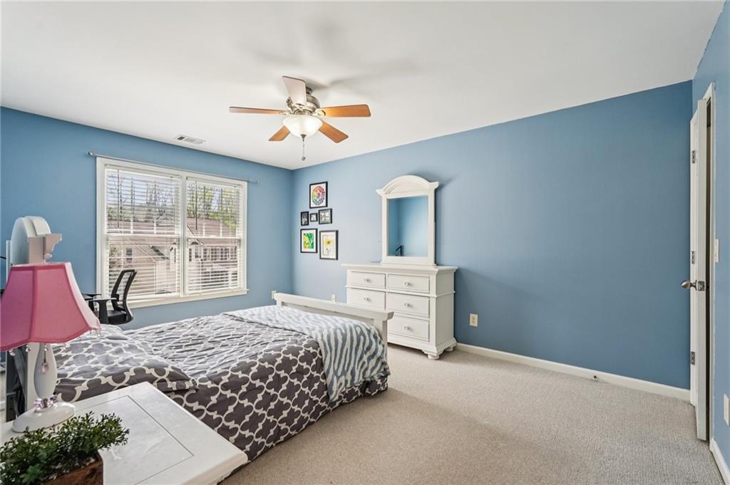 4708 Arbor Crest Place Suwanee, GA 30024 - Photo 56 of 102 a bedroom with a bed dresser and a window