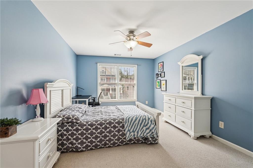 4708 Arbor Crest Place Suwanee, GA 30024 - Photo 57 of 102 a bedroom with a bed dresser and a window