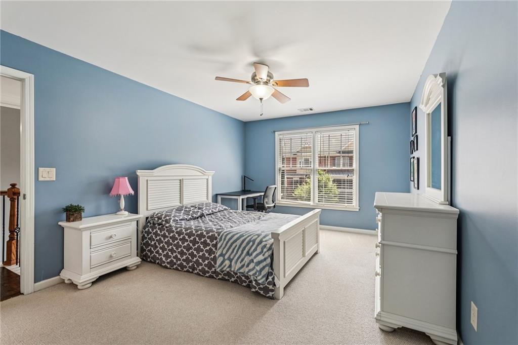 4708 Arbor Crest Place Suwanee, GA 30024 - Photo 58 of 102 a bedroom with a bed dresser and a window