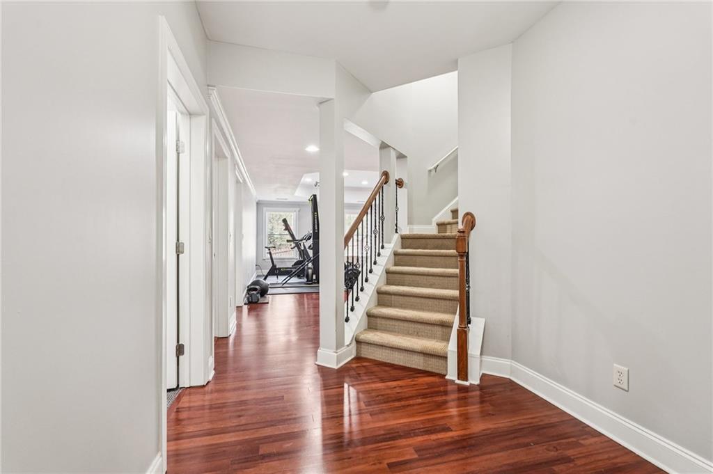 4708 Arbor Crest Place Suwanee, GA 30024 - Photo 59 of 102 a view of entryway and hall with wooden floor