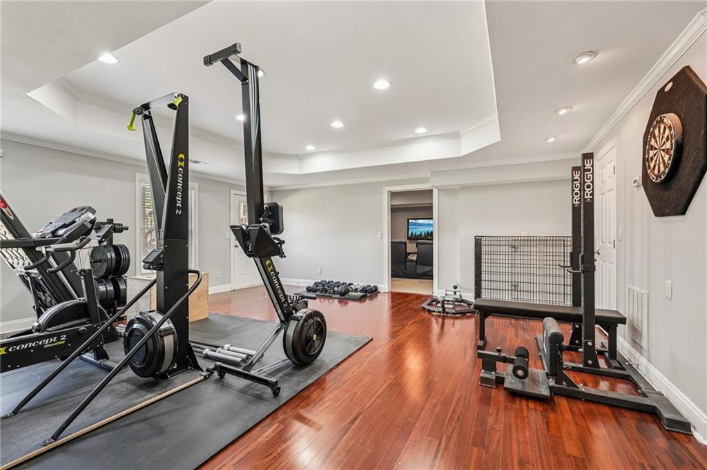 4708 Arbor Crest Place Suwanee, GA 30024 - Photo 60 of 102 a view of a room with gym equipment