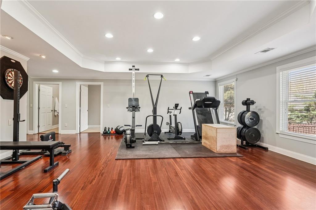 4708 Arbor Crest Place Suwanee, GA 30024 - Photo 61 of 102 a view of a room with gym equipment
