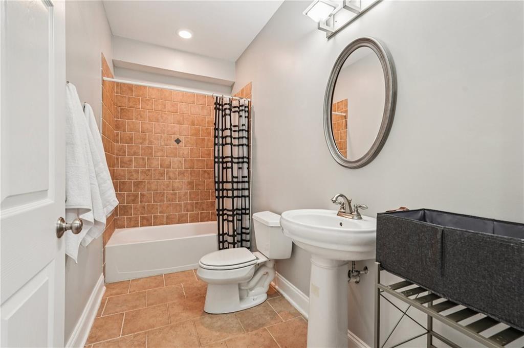 4708 Arbor Crest Place Suwanee, GA 30024 - Photo 70 of 102 a bathroom with a sink toilet and shower