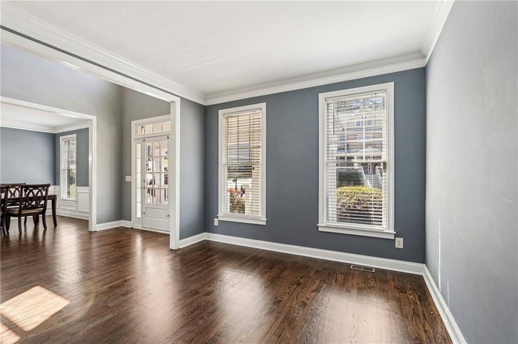 4708 Arbor Crest Place Suwanee, GA 30024 - Photo 7 of 102 an empty room with wooden floor and windows