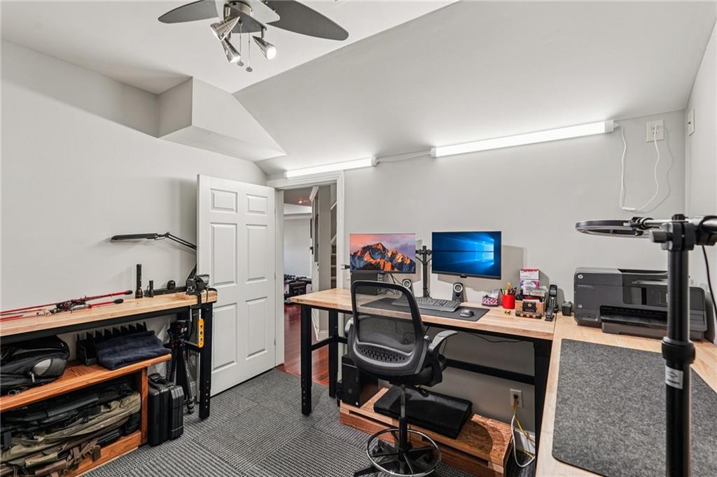 4708 Arbor Crest Place Suwanee, GA 30024 - Photo 73 of 102 a room with furniture and a flat screen tv