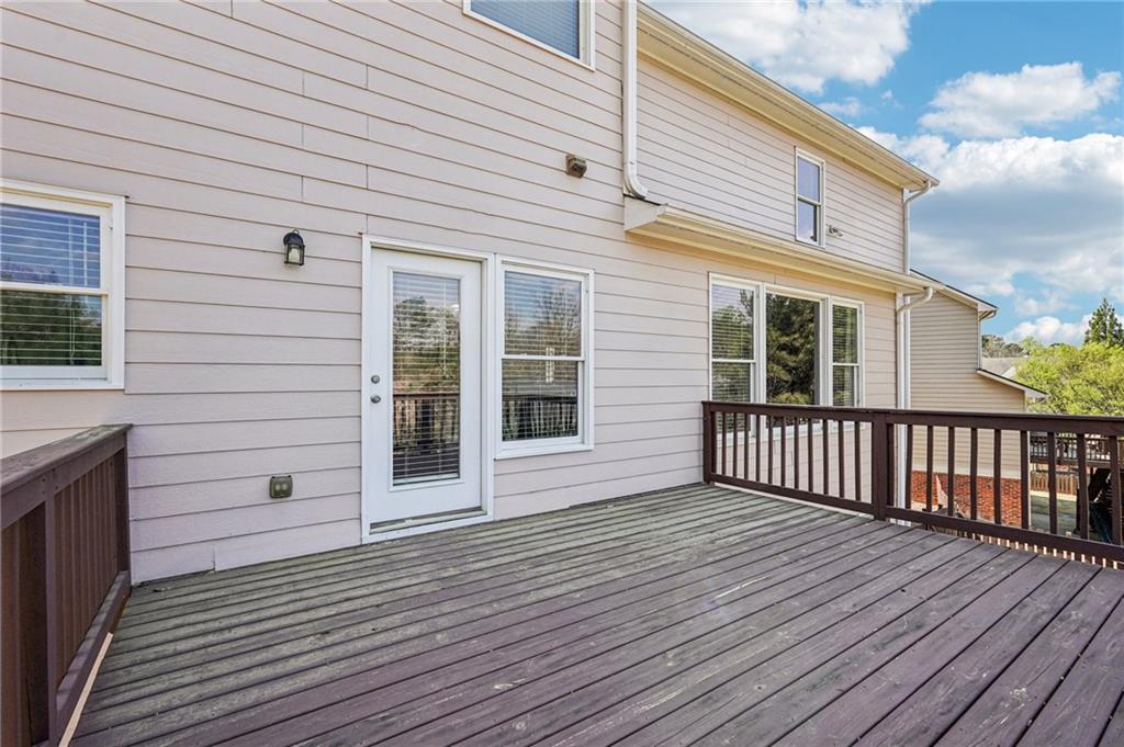 4708 Arbor Crest Place Suwanee, GA 30024 - Photo 75 of 102 a view of a house with wooden deck