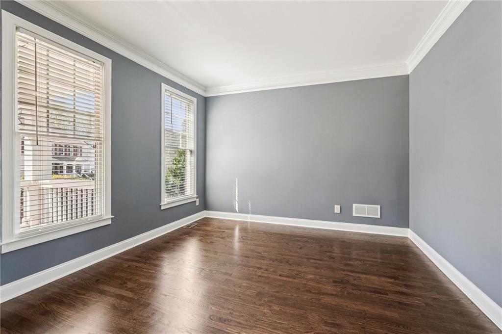 4708 Arbor Crest Place Suwanee, GA 30024 - Photo 8 of 102 wooden floor in an empty room with a window