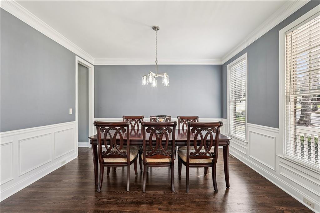 4708 Arbor Crest Place Suwanee, GA 30024 - Photo 10 of 102 a view of a dining room with furniture window and wooden floor