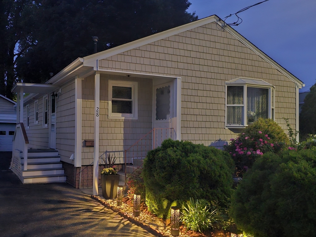 28 State Street Chicopee, MA 01013 - Photo 4 of 25 a front view of a house with a yard