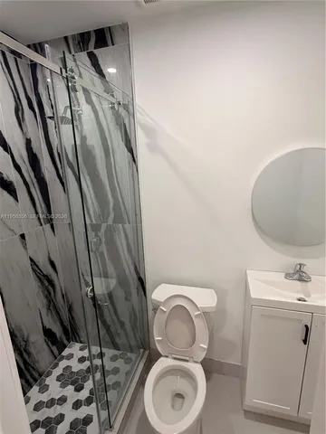 a bathroom with a toilet and a sink