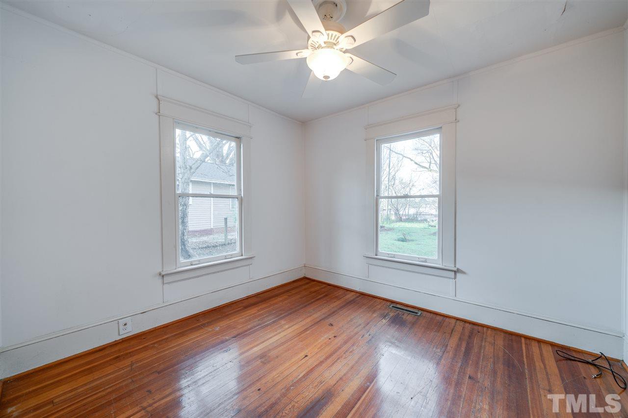 3133 Stanhope Avenue Raleigh, NC 27607 - Photo 13 of 21 wooden floor in an empty room with a window